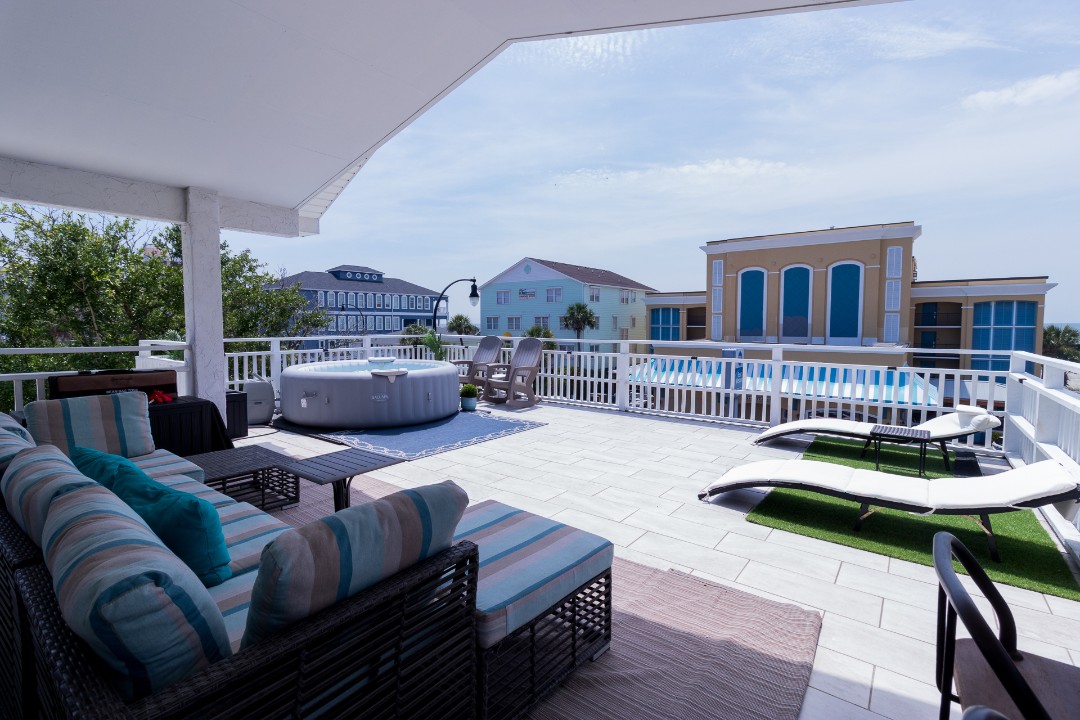 Private deck hot tub at The Coastal Crown Penthouse